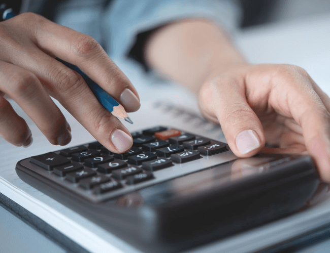 A workers' comp lawyer calculates the PA statewide average weekly wage on a calculator for a client