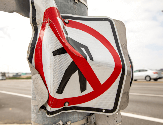 Destroyed no pedestrian sign